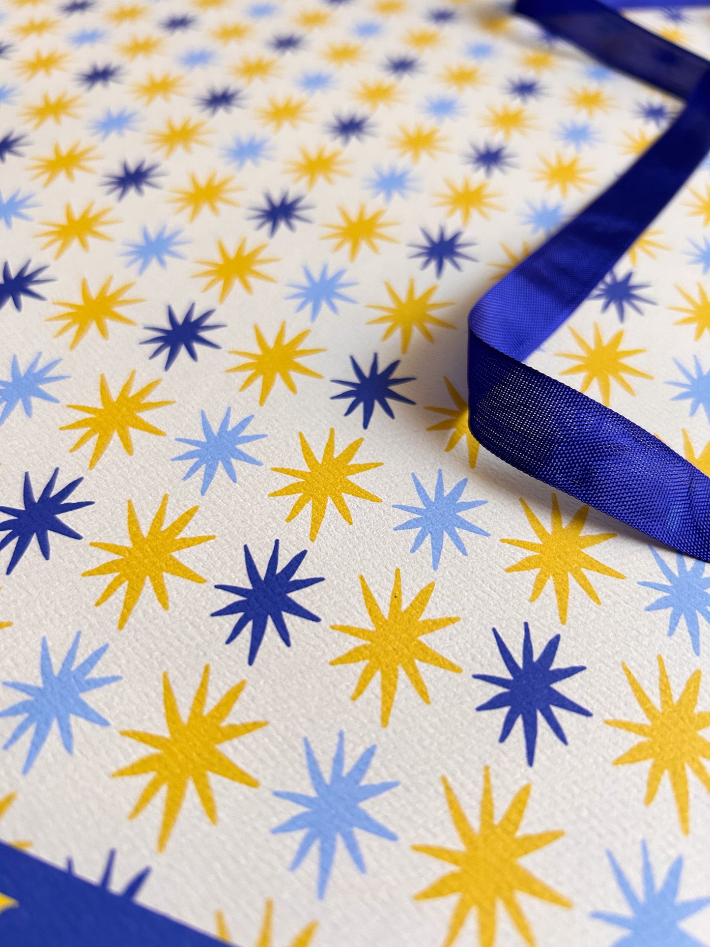 close up of hand drawn star patterned crafting paper