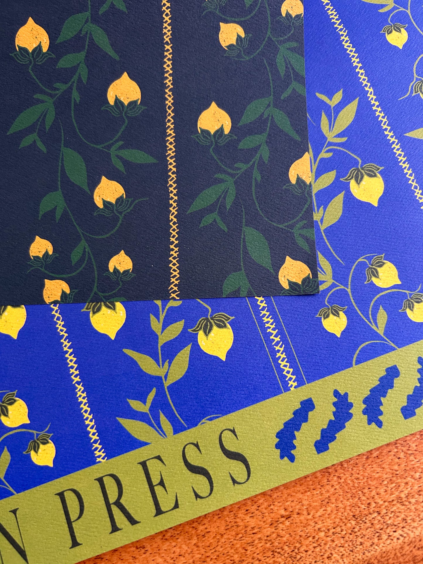 close up of double sided patterned wrapping paper with dark and light colorways