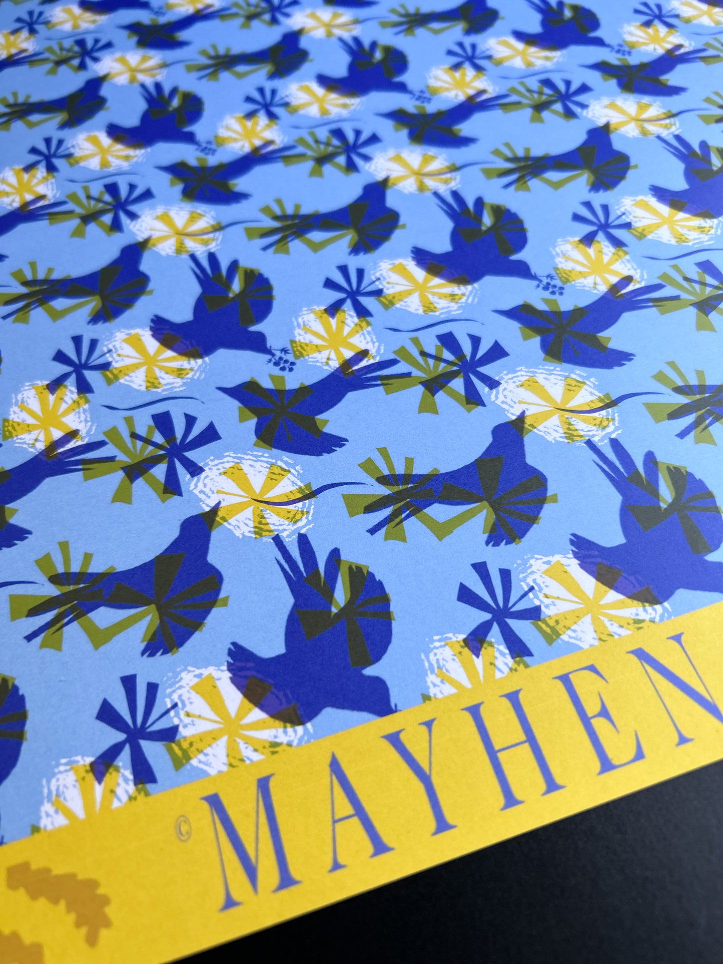 close up of light blue bird patterned wrapping paper