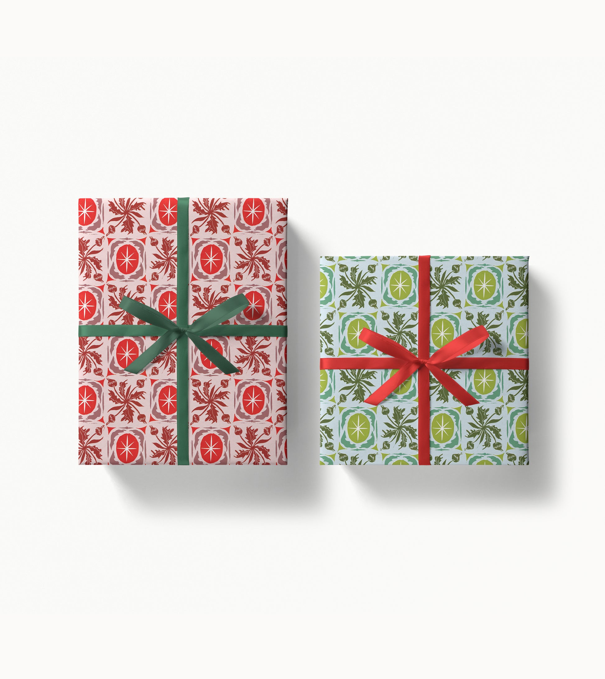Two gift boxes with festive artist designed patterns and ribbons on a white background
