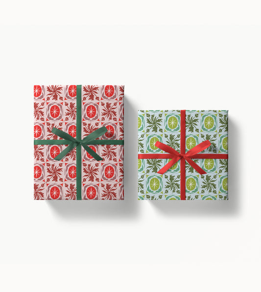 Two gift boxes with festive artist designed patterns and ribbons on a white background