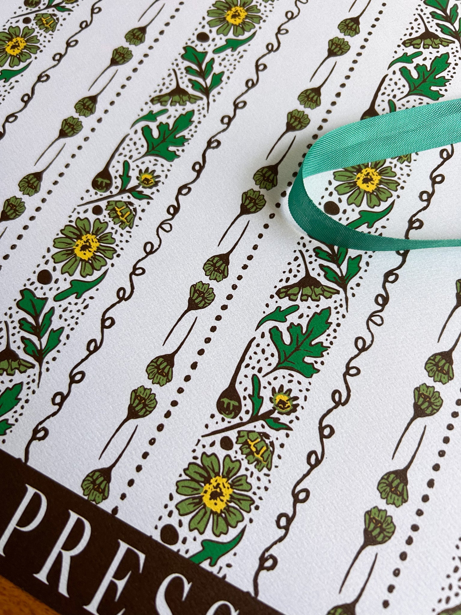 close up of chamomile floral stripe patterned crafting paper