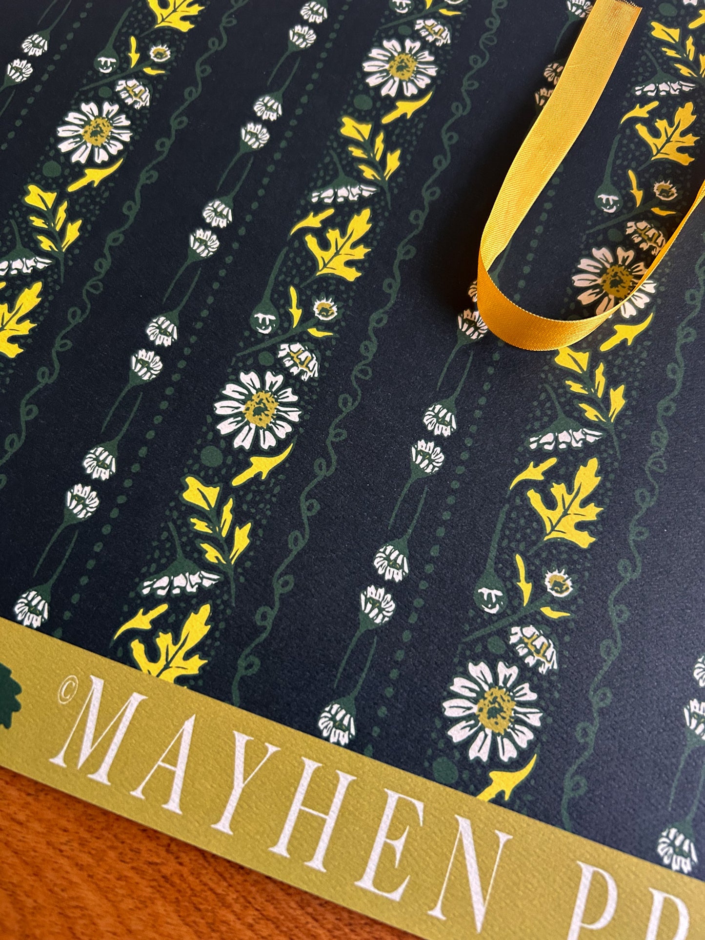 close up of chamomile floral stripe patterned crafting paper