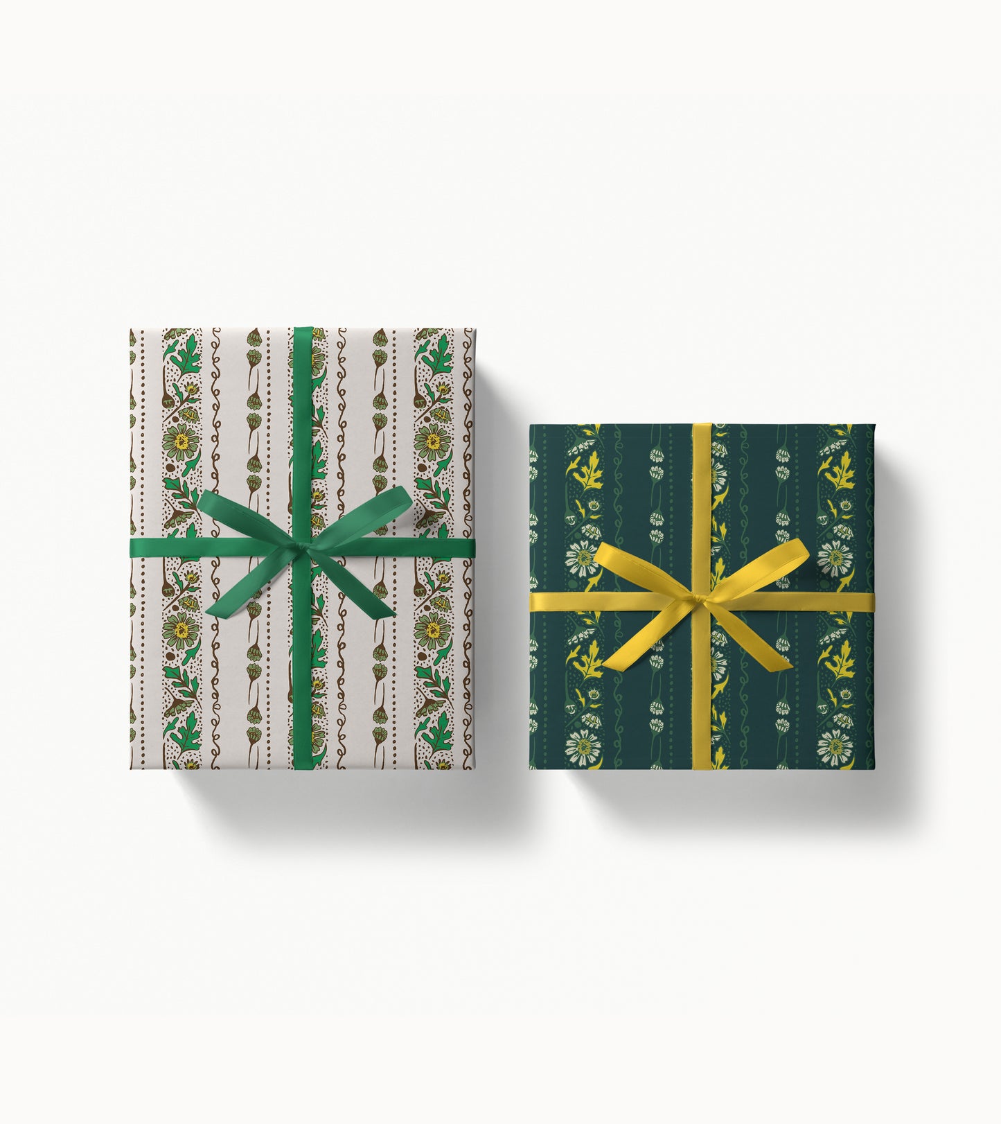 Two wrapped gift boxes with decorative floral stripe wrapping paper and ribbons on a white background