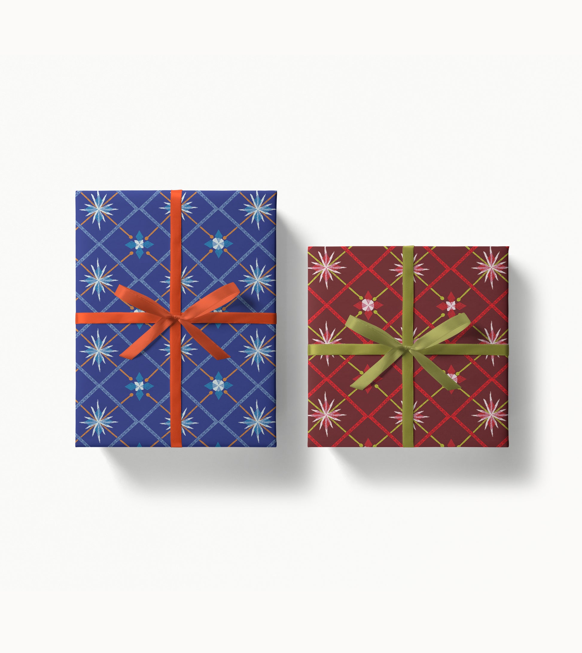 Two gift boxes with decorative patterned paper and ribbons on a white background