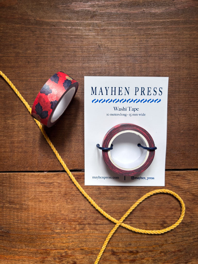 Mayhen Press floral scatter washi tape with packaging on a wooden surface