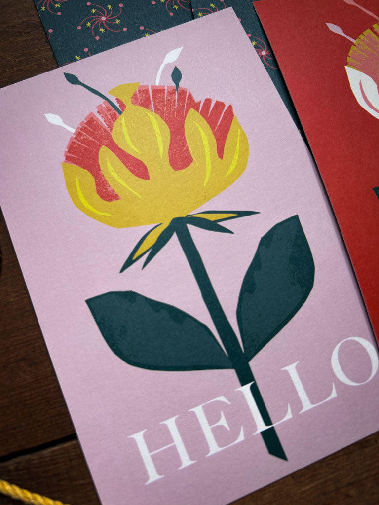 Card with a yellow and pink floral design and 'HELLO' text on a pink background
