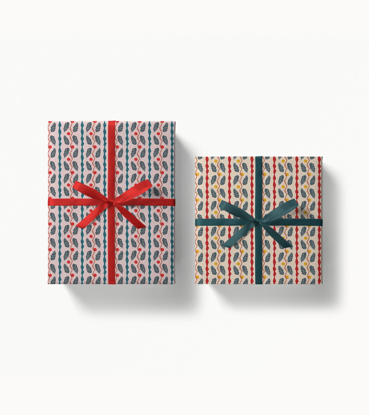 Two gift boxes with decorative patterned paper and ribbons on a white background