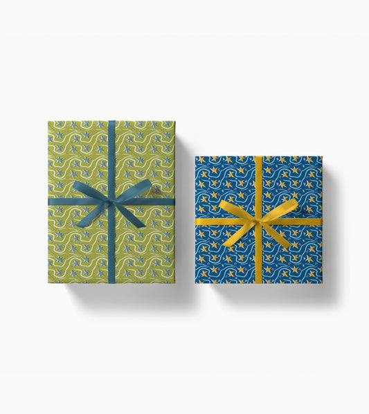 Two gift boxes wrapped with decorative patterned paper and ribbons on a white background