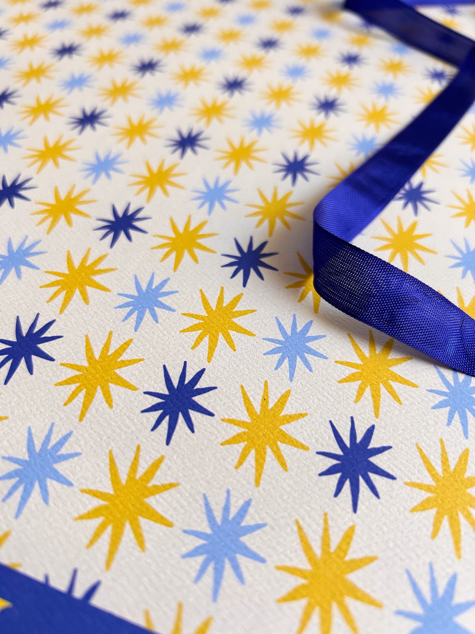 close up of hand drawn star patterned crafting paper