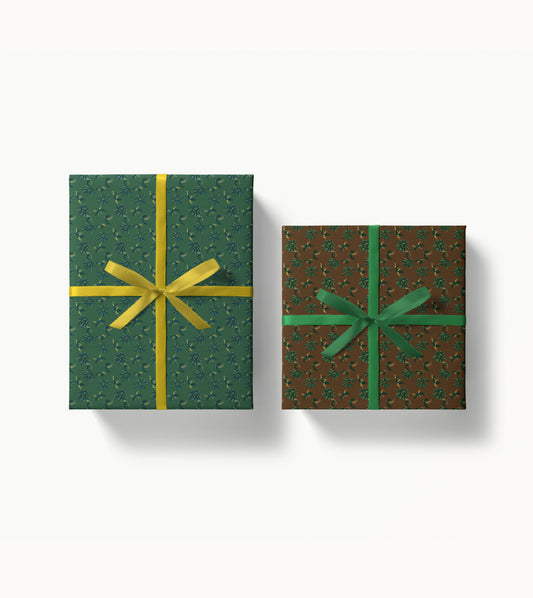 Two wrapped gift boxes with decorative floral patterned paper and ribbons on a white background