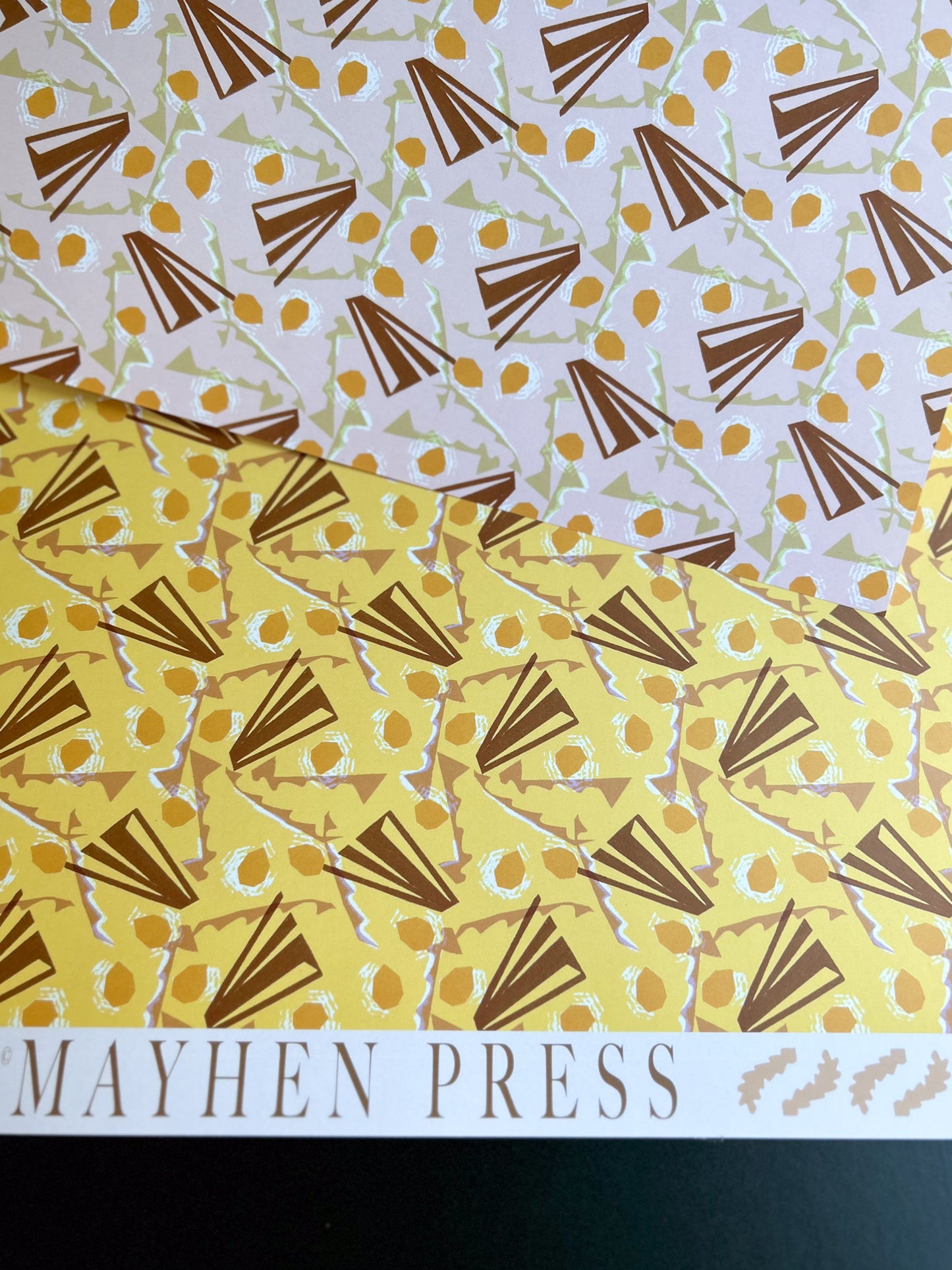 abstract patterned collage crafting and wrapping paper with 'Mayhen Press' branding