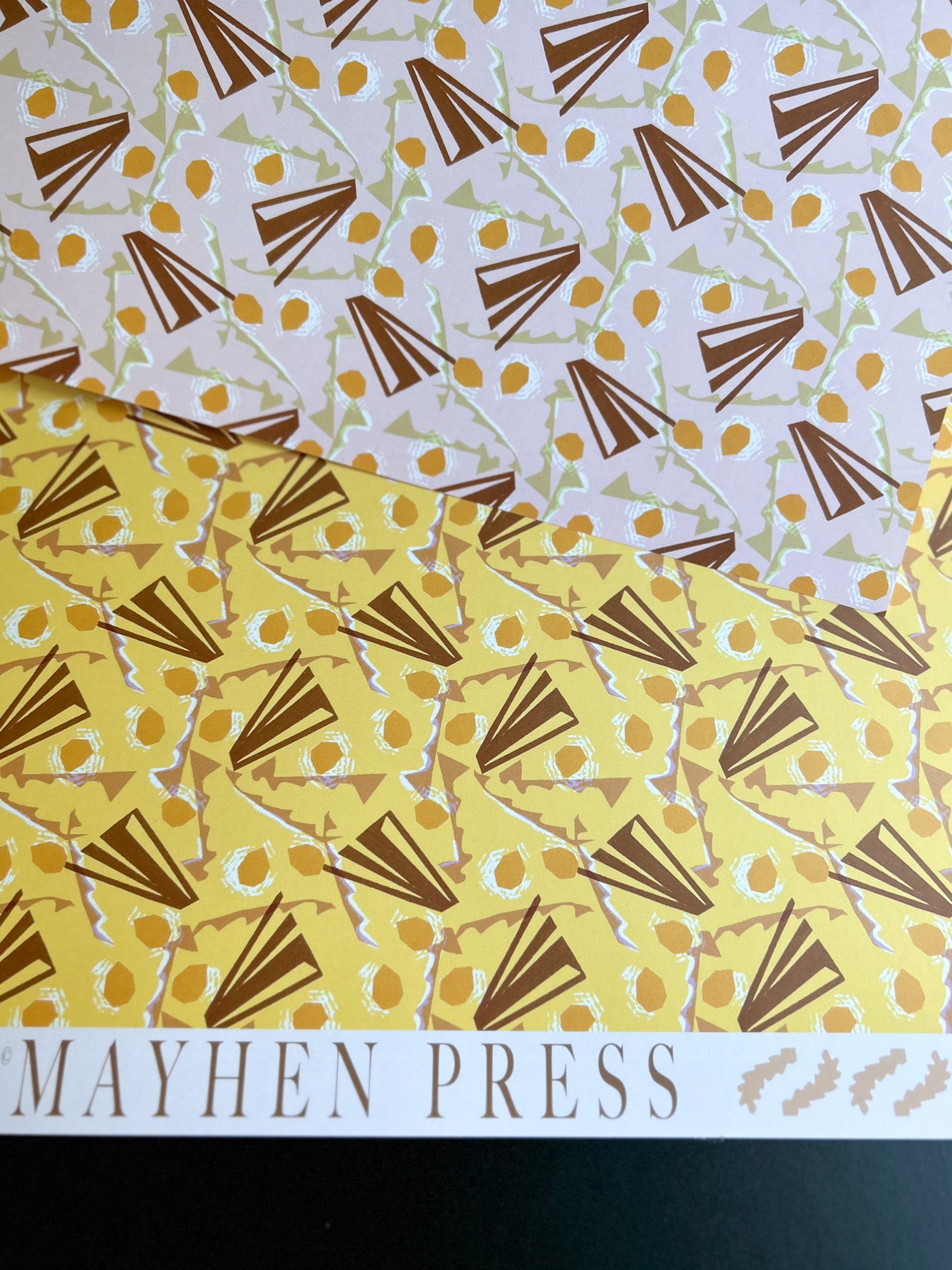 abstract patterned collage crafting and wrapping paper with 'Mayhen Press' branding